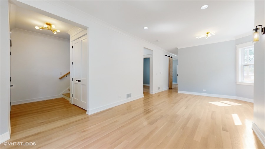 4115 North Ridgeway Avenue Chicago, IL 60618 - Photo 9 of 46 a view of empty room with wooden floor