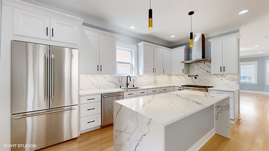 4115 North Ridgeway Avenue Chicago, IL 60618 - Photo 10 of 46 a kitchen with stainless steel appliances granite countertop a refrigerator a stove a sink and a refrigerator