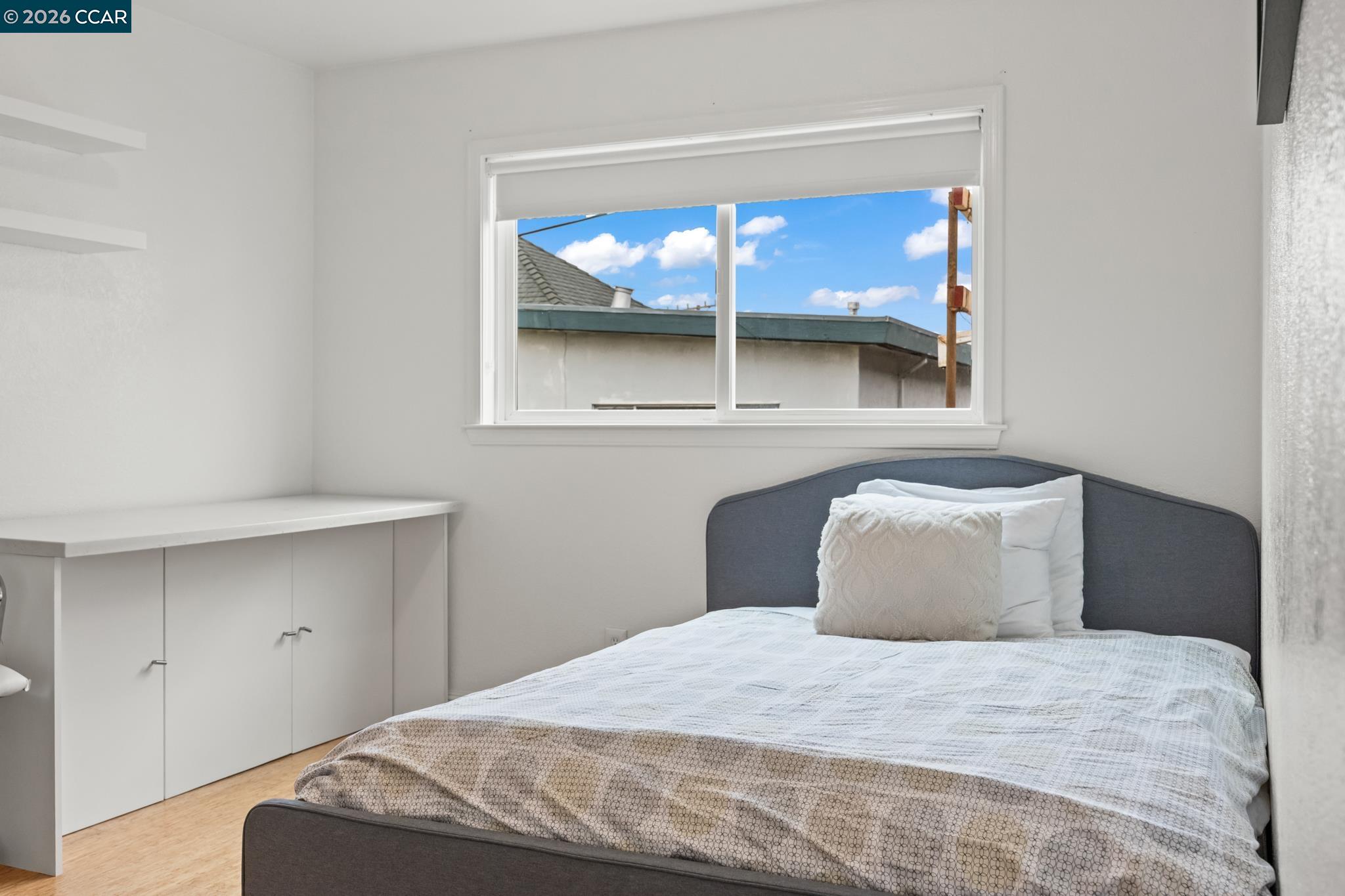 2327 Tenth Street, Unit 4 Berkeley, CA 94710 - Photo 17 of 39 a bedroom with a bed and window