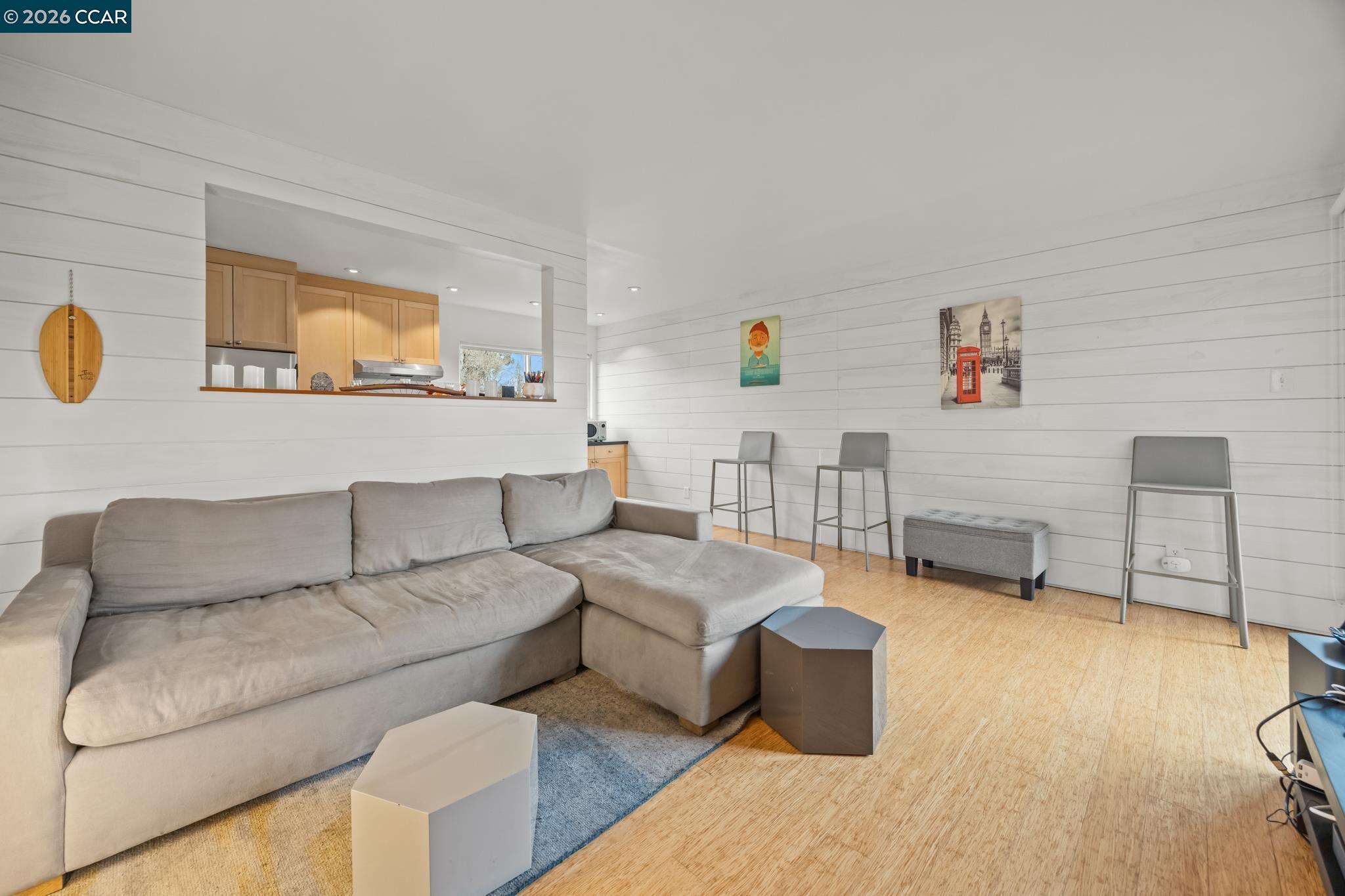 2327 Tenth Street, Unit 4 Berkeley, CA 94710 - Photo 2 of 39 a living room with furniture and a flat screen tv
