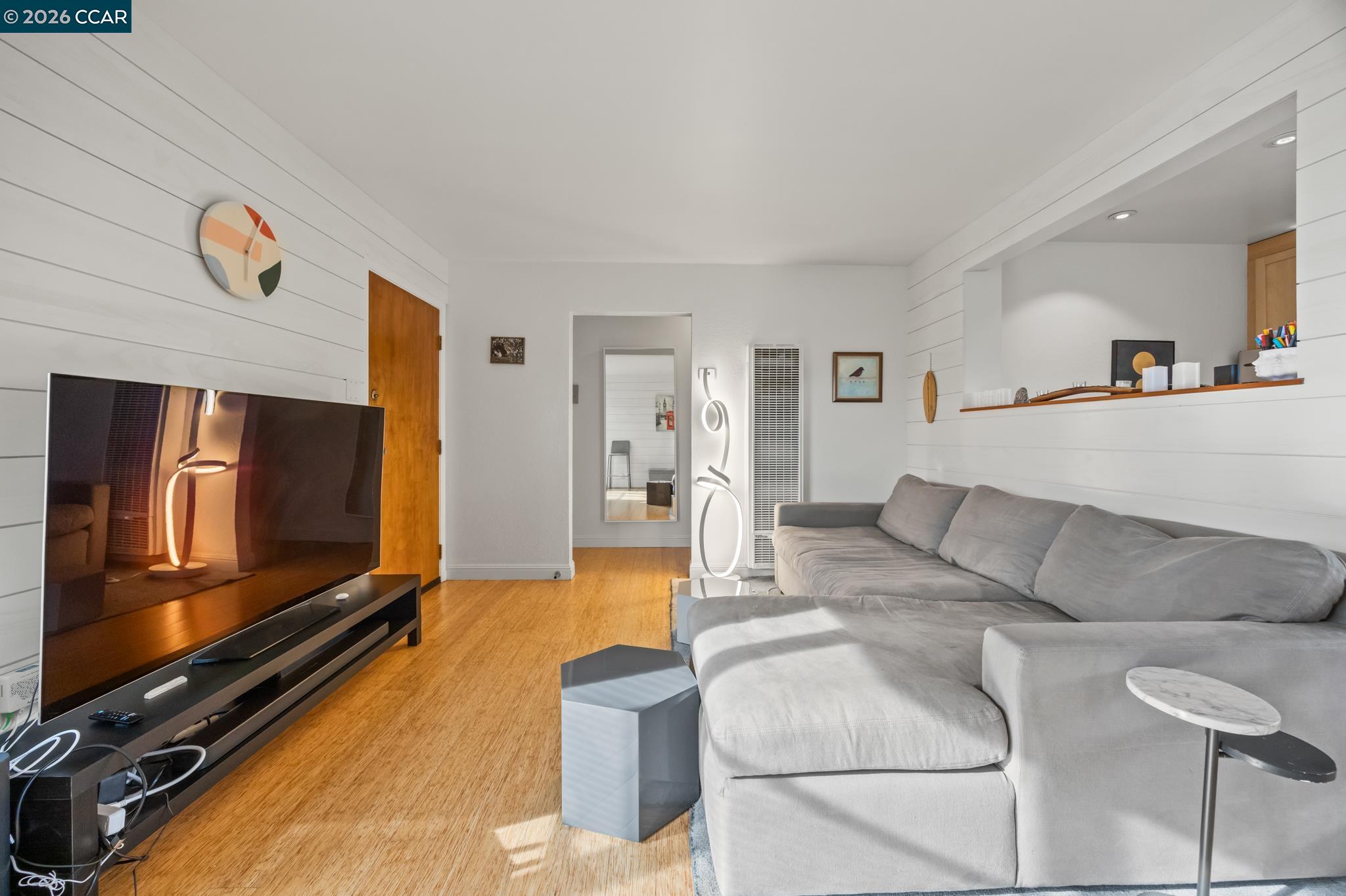 2327 Tenth Street, Unit 4 Berkeley, CA 94710 - Photo 6 of 39 a living room with furniture and a flat screen tv