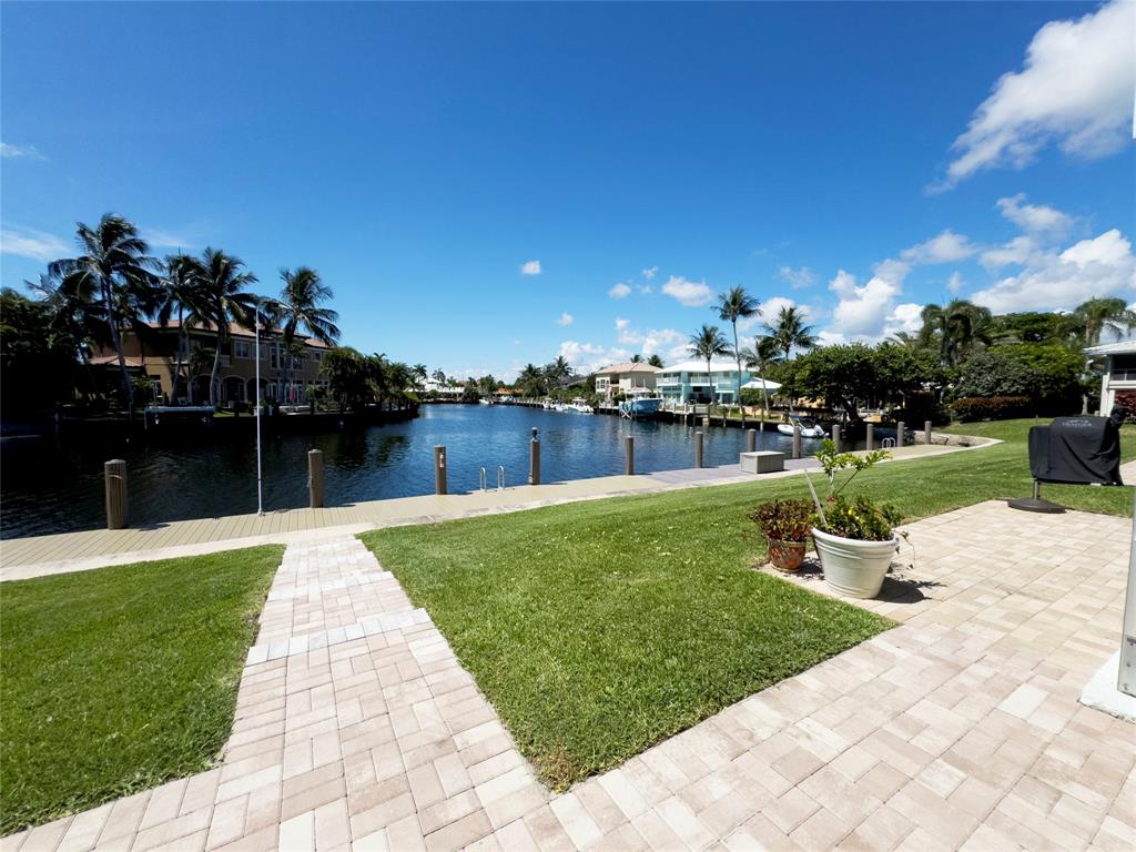 2330 Northeast 36th Street, Unit 11 Lighthouse Point, FL 33064 - Photo 8 of 11 a view of a garden with plants
