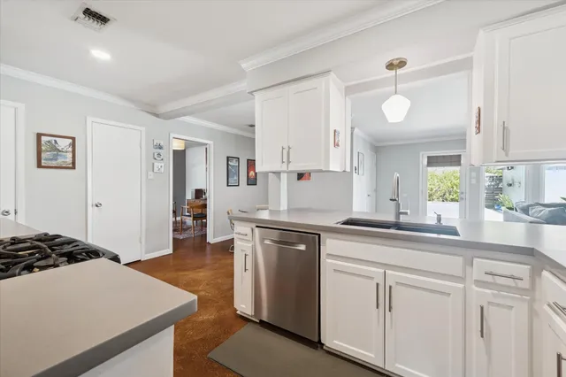 a kitchen with a cabinets and chairs