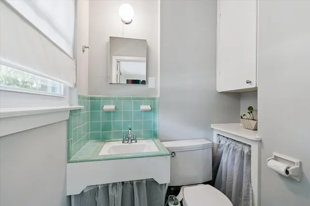 a bedroom with a bed furniture and a large window