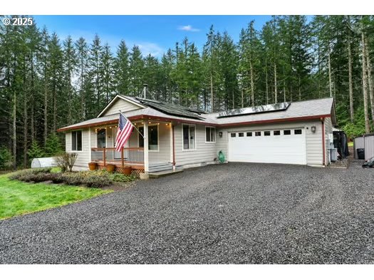 76500 Delena Mayger Road Rainier, OR 97048 - Photo 1 of 24 a view of a house with a backyard
