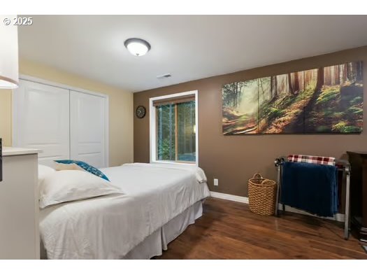 76500 Delena Mayger Road Rainier, OR 97048 - Photo 12 of 24 a bedroom with a bed and a large window