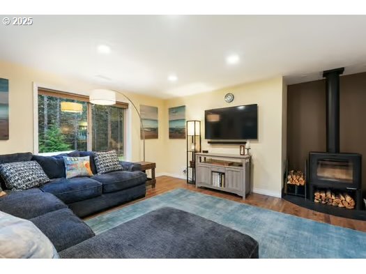76500 Delena Mayger Road Rainier, OR 97048 - Photo 3 of 24 a living room with furniture and a flat screen tv