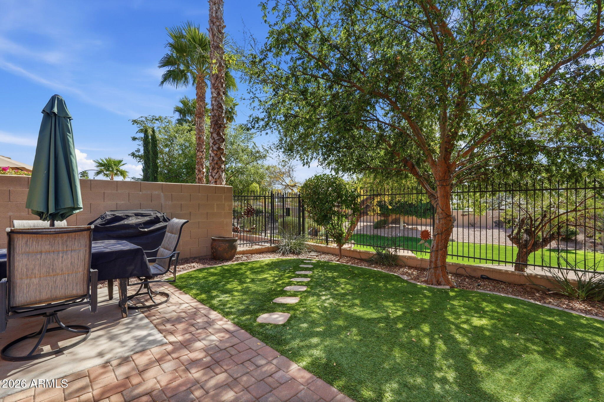 6202 East McKellips Road, Unit 11 Mesa, AZ 85215 - Photo 19 of 21 a view of a backyard with sitting area