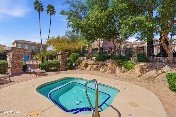 a view of a house with backyard porch and sitting area