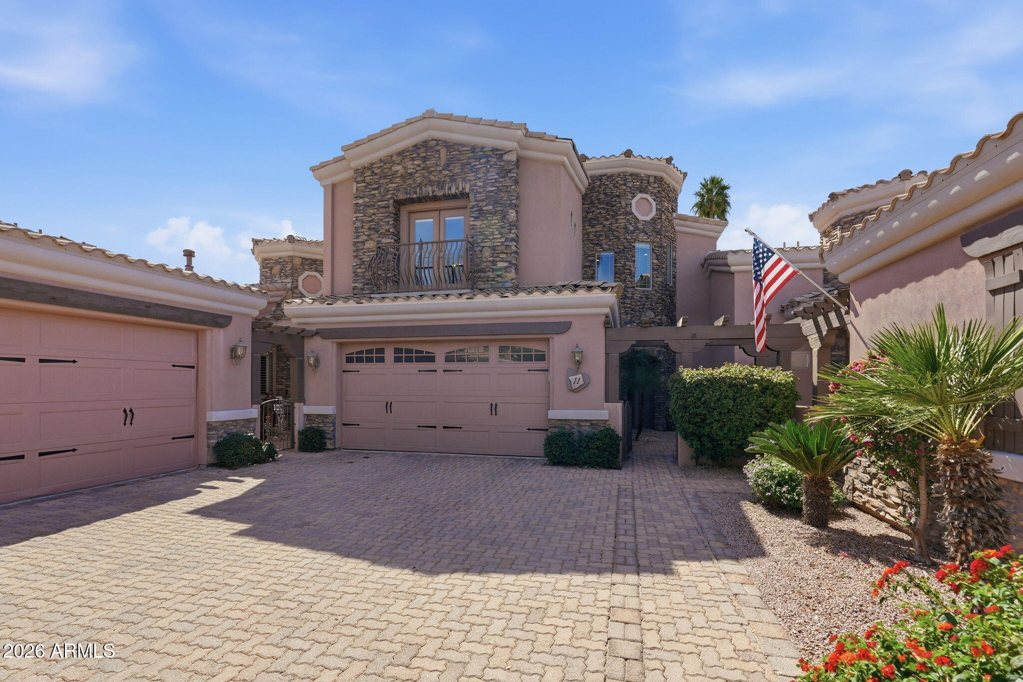 6202 East McKellips Road, Unit 11 Mesa, AZ 85215 - Photo 2 of 21 a front view of a house with a yard and garage