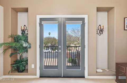 a bedroom with a bed couch and window