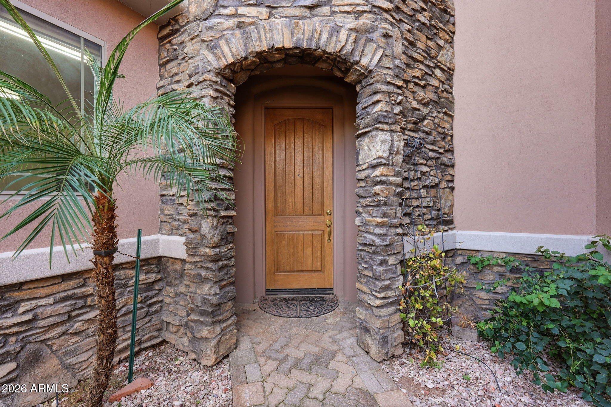 6202 East McKellips Road, Unit 11 Mesa, AZ 85215 - Photo 3 of 21 a view of a wooden door of the house