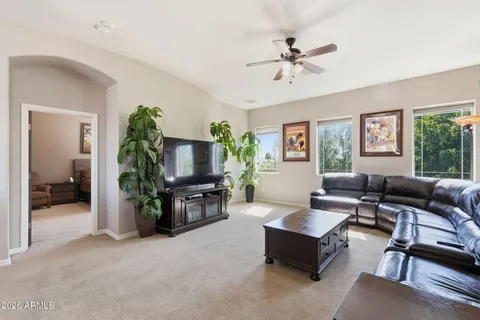 a view of a house with backyard porch and sitting area