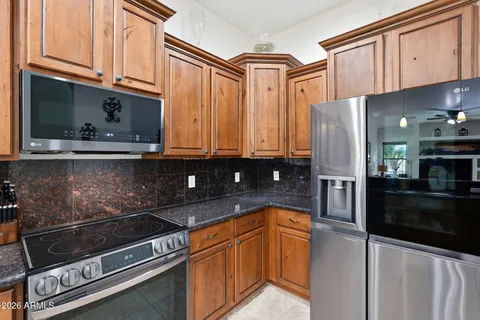 a living room with furniture and a clock