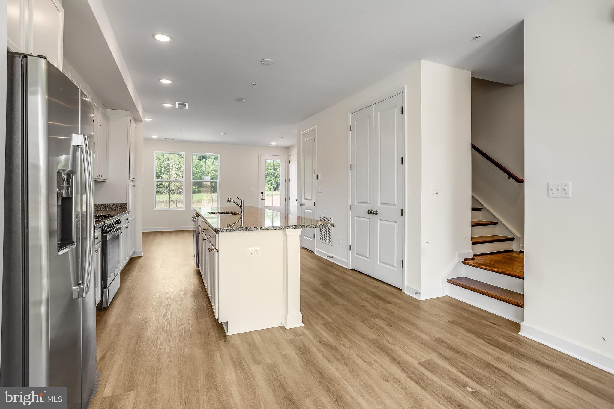 1811 Shookstown Road Frederick, MD 21702 - Photo 13 of 37 a view of a kitchen with wooden floor and electronic appliances
