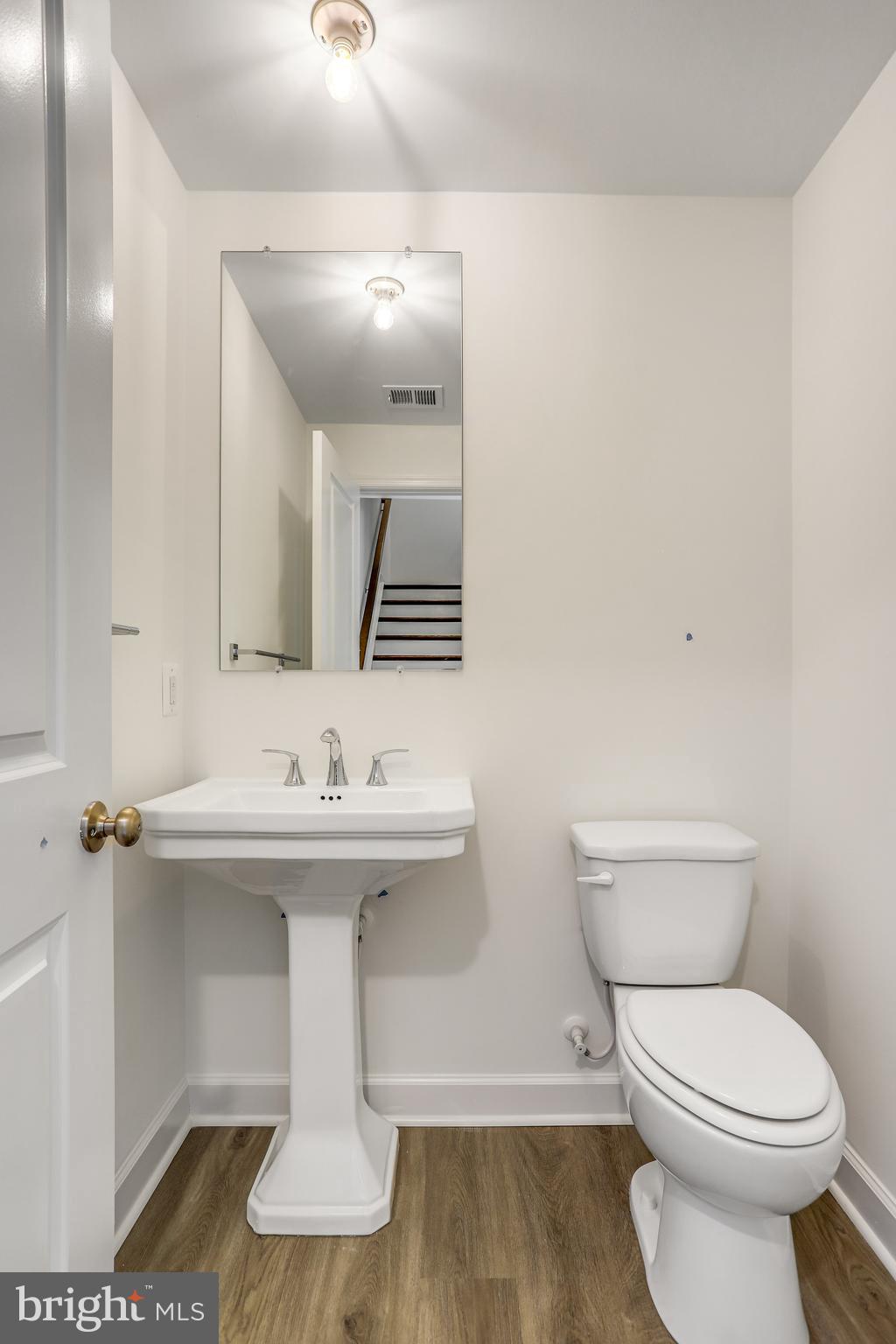 1811 Shookstown Road Frederick, MD 21702 - Photo 19 of 37 a bathroom with a sink and a toilet
