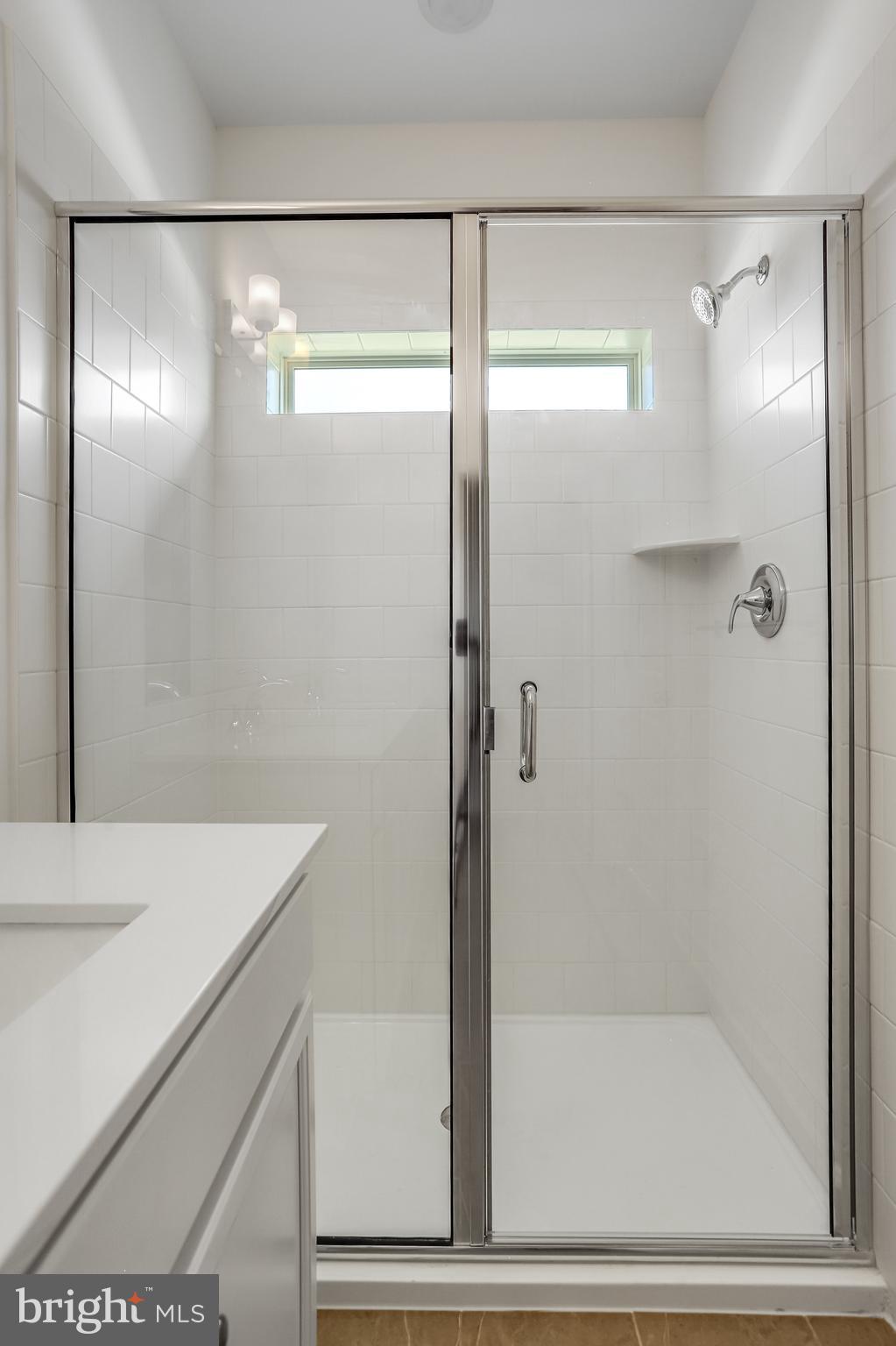 1811 Shookstown Road Frederick, MD 21702 - Photo 26 of 37 a bathroom with a bathtub and a shower