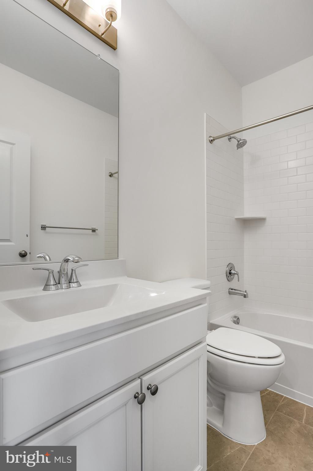 1811 Shookstown Road Frederick, MD 21702 - Photo 29 of 37 a bathroom with a sink a toilet and shower