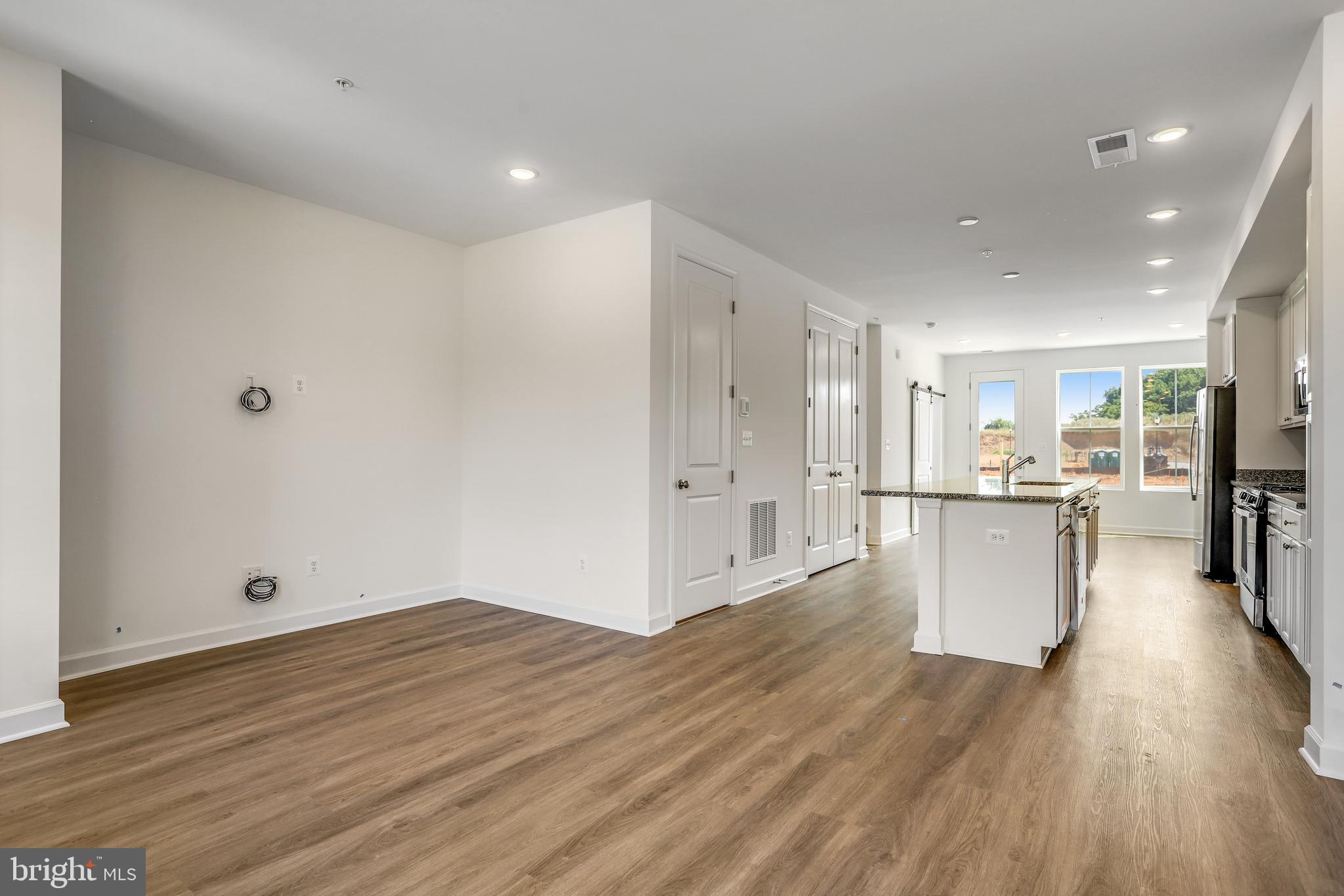1811 Shookstown Road Frederick, MD 21702 - Photo 8 of 37 a view of a kitchen with wooden floor
