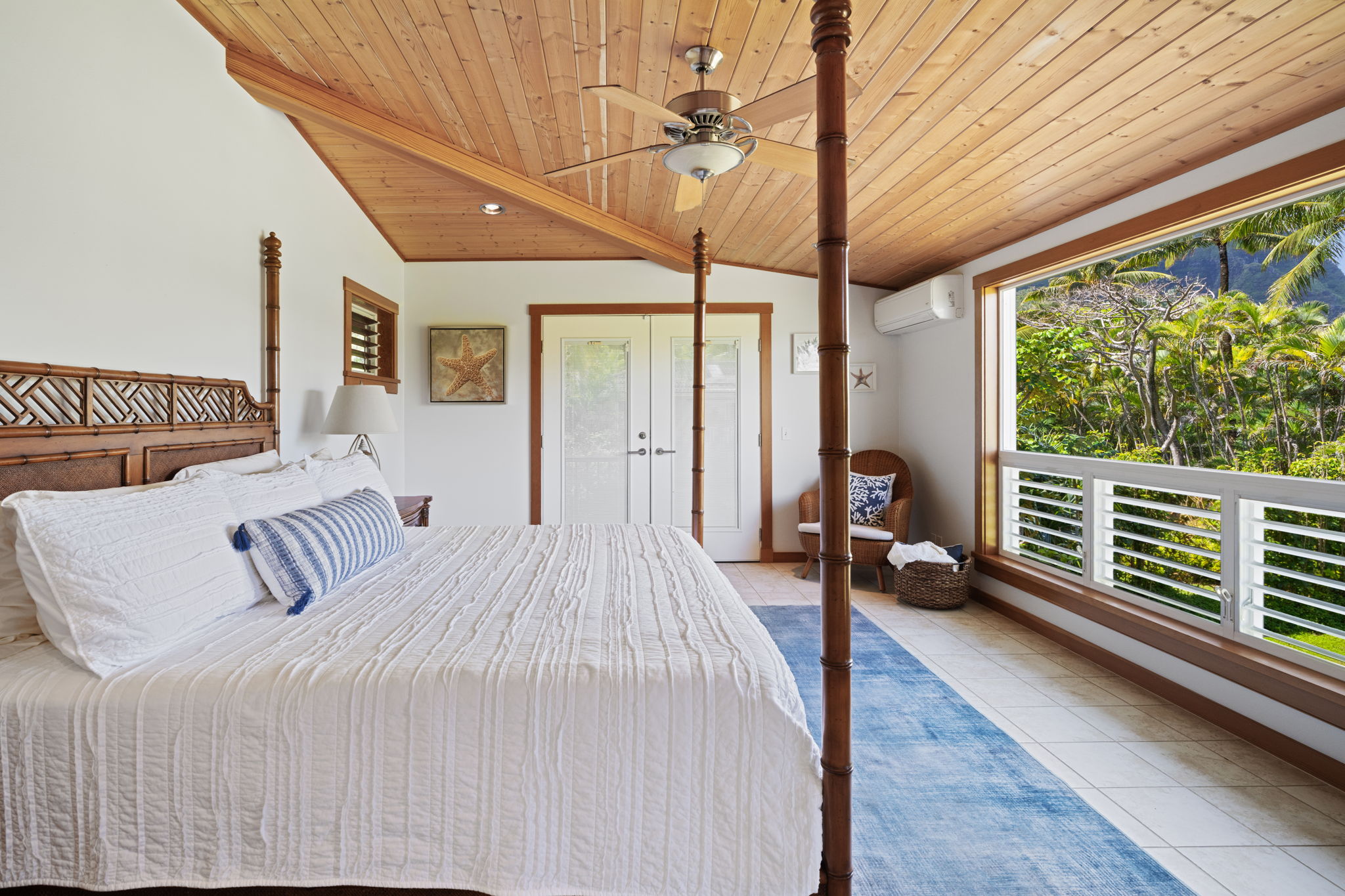7312 Alealea Road Hanalei, HI 96714 - Photo 15 of 30 a bedroom with large bed and wooden floor