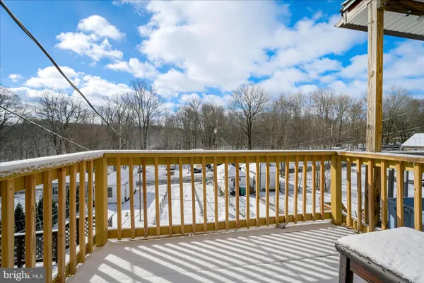 a balcony with wooden floor