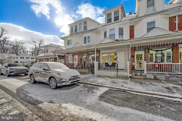 a car parked in front of a house