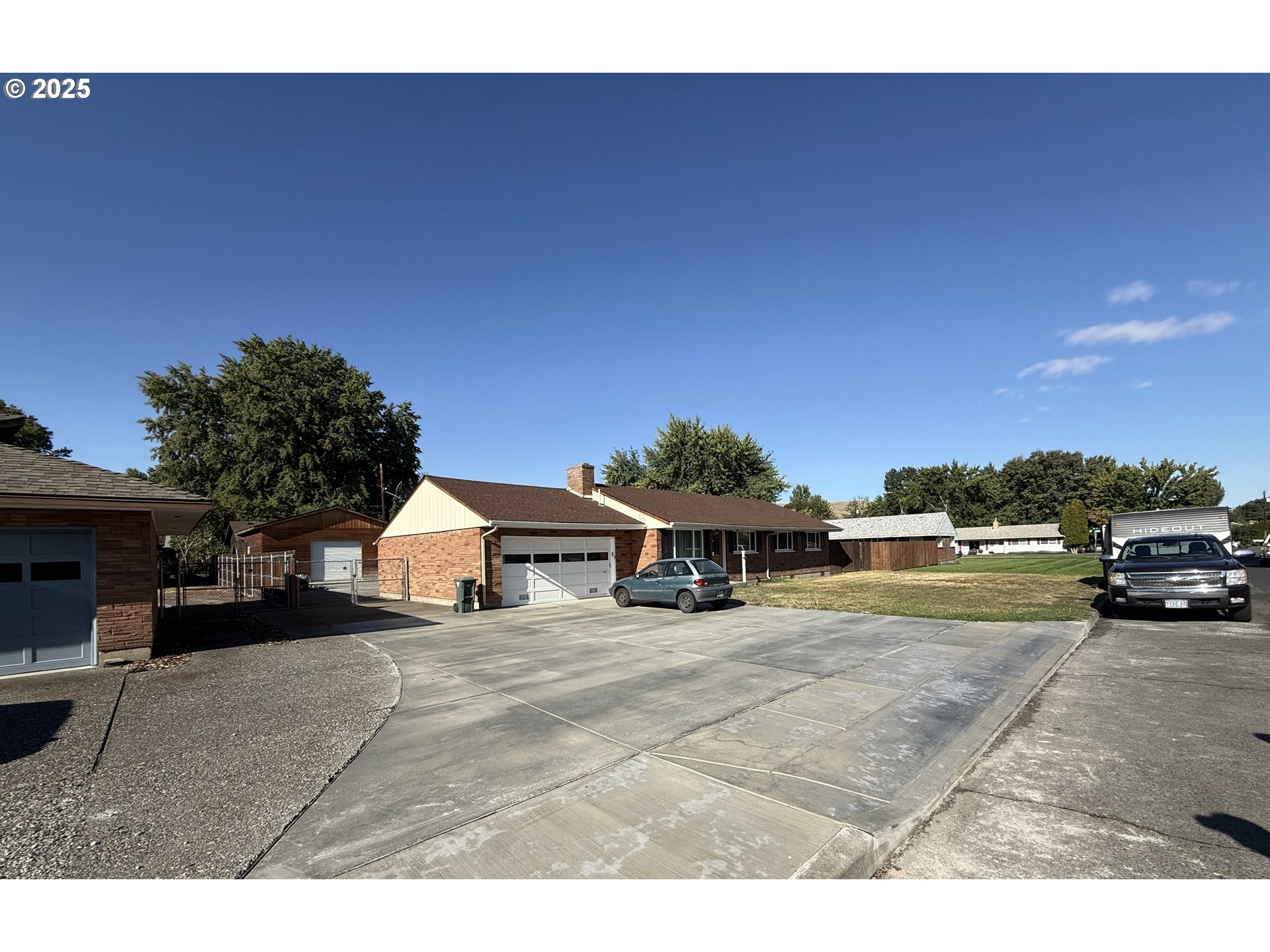 a view of a house with outdoor space and sitting area