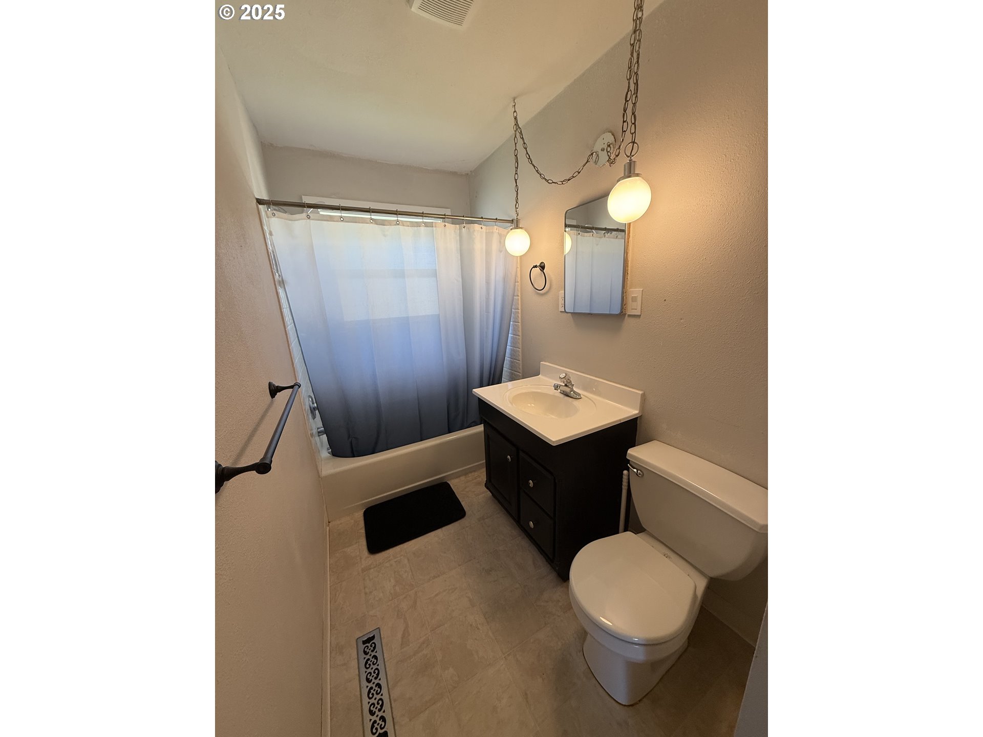 1511 Southwest 41st Street Pendleton, OR 97801 - Photo 18 of 18 a bathroom with a toilet sink and mirror