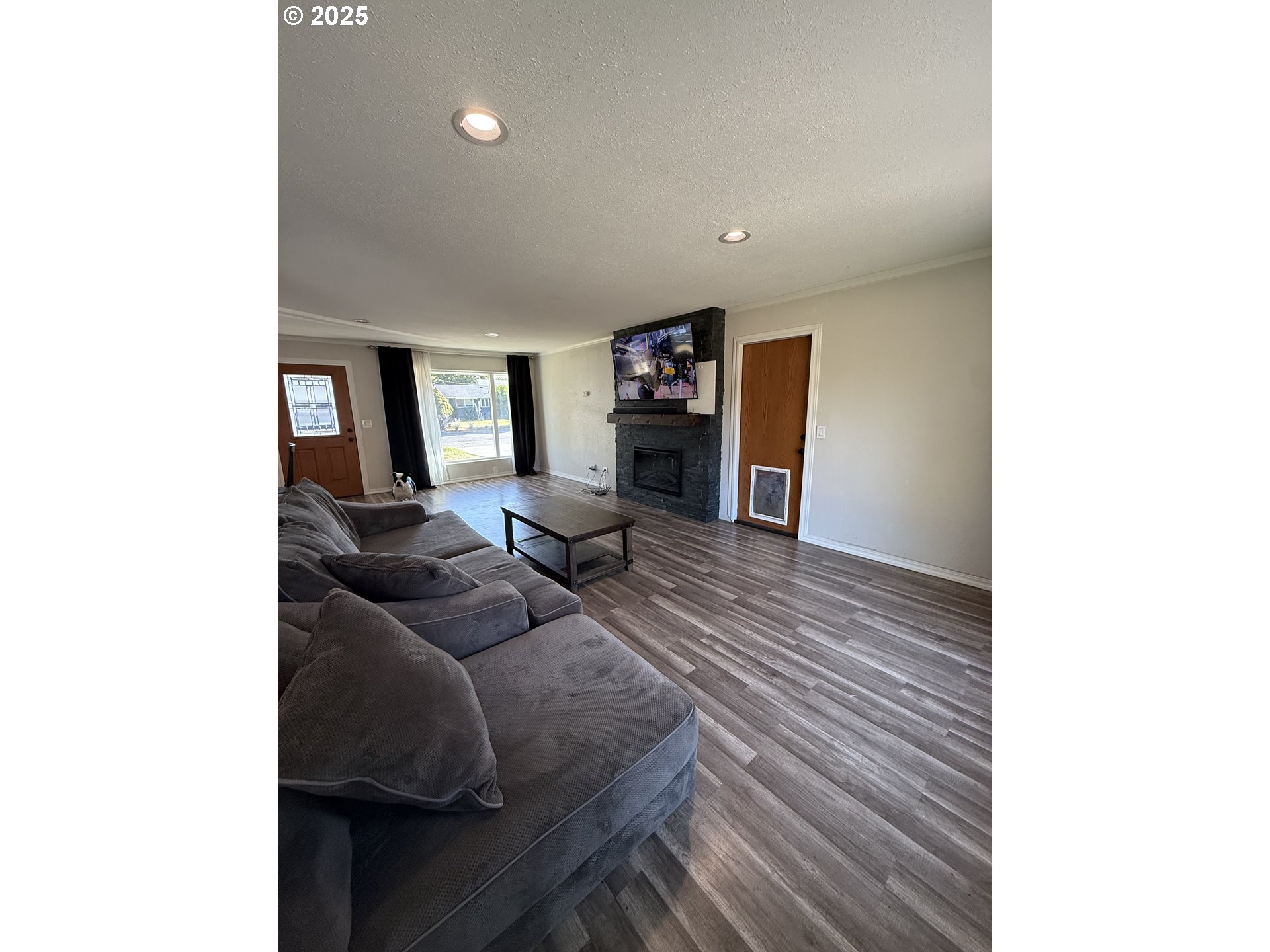 1511 Southwest 41st Street Pendleton, OR 97801 - Photo 2 of 18 a living room with furniture and a flat screen tv