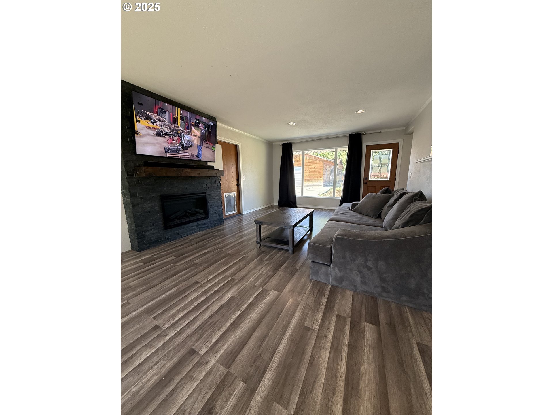 1511 Southwest 41st Street Pendleton, OR 97801 - Photo 3 of 18 a living room with furniture and a fireplace