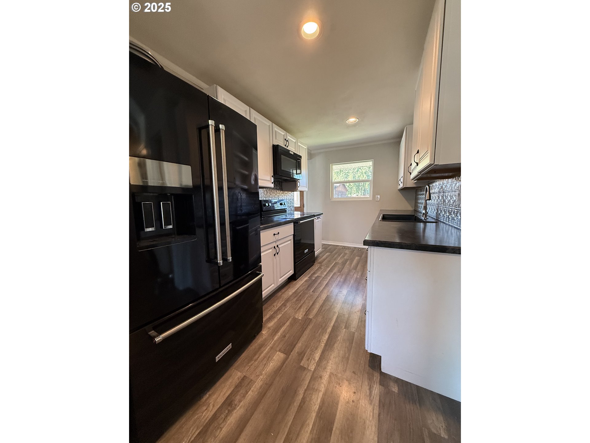 1511 Southwest 41st Street Pendleton, OR 97801 - Photo 4 of 18 a kitchen with stainless steel appliances granite countertop a refrigerator and a stove top oven
