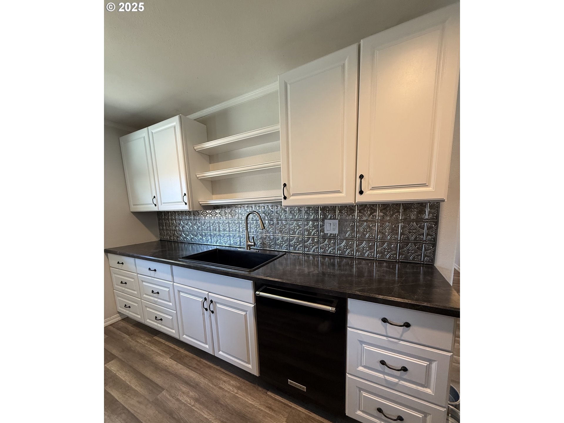 1511 Southwest 41st Street Pendleton, OR 97801 - Photo 5 of 18 a kitchen with granite countertop white cabinets and sink