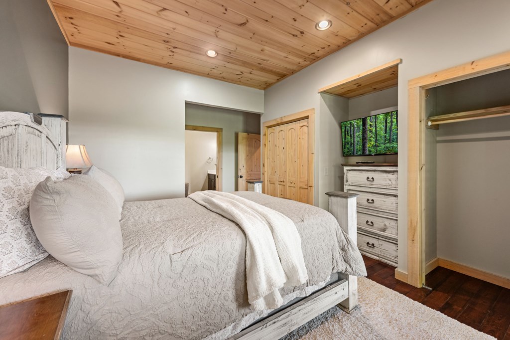 479 Big Timber Road Mineral Bluff, GA 30559 - Photo 21 of 60 a large bed sitting in a bedroom next to a window