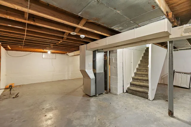 a view of an empty room with stairs