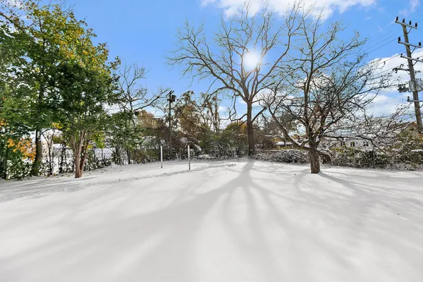 a view of a house with a snow in the yard