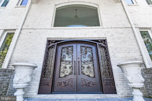 a black and white wall with door
