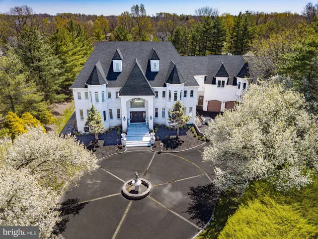 an aerial view of a house with yard