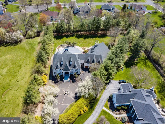 an aerial view of house with yard swimming pool and outdoor seating