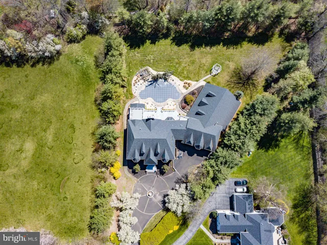 an aerial view of house with yard swimming pool and outdoor seating