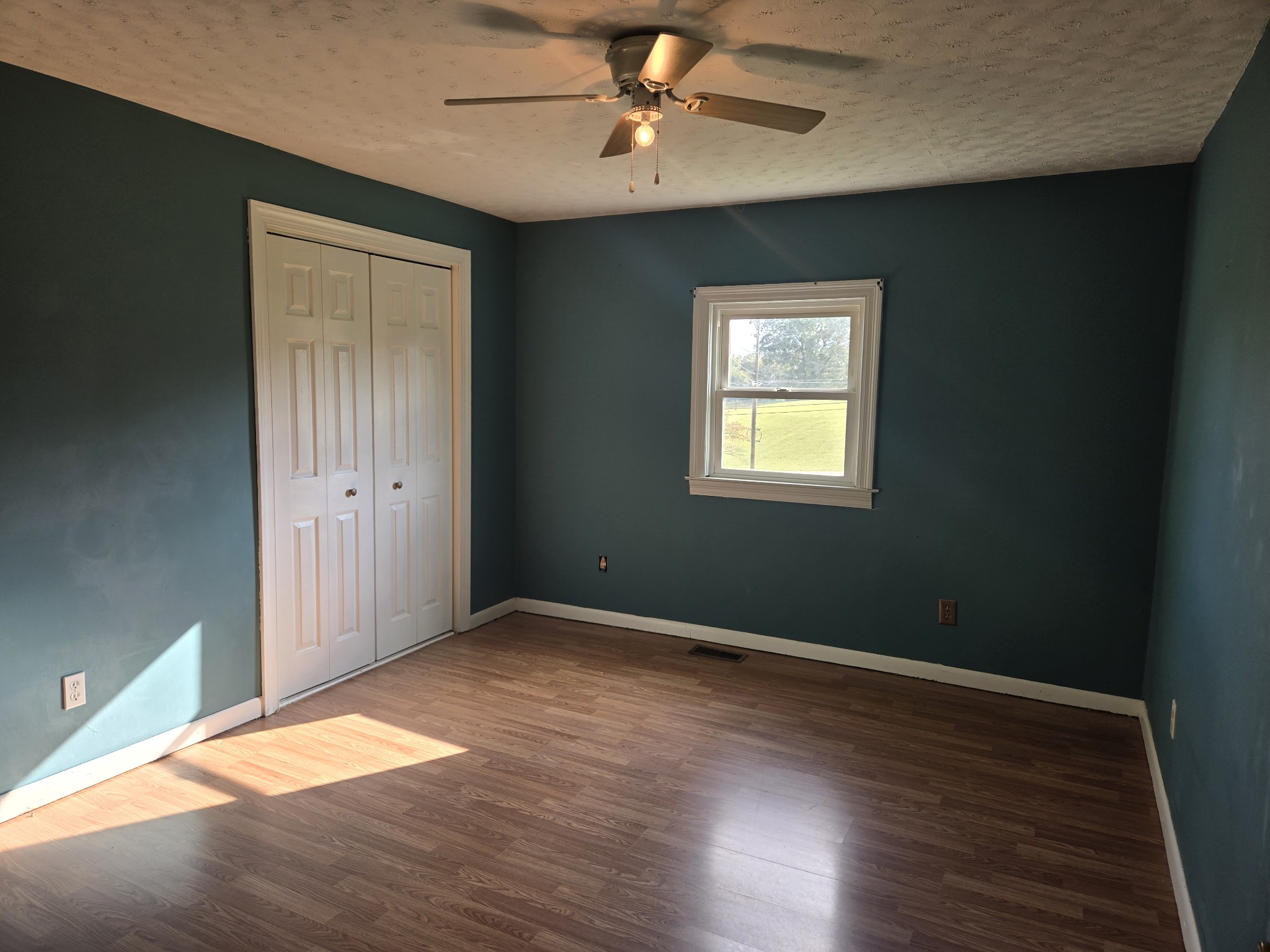 4671 Talley Road Springfield, TN 37172 - Photo 9 of 19 an empty room with wooden floor and windows