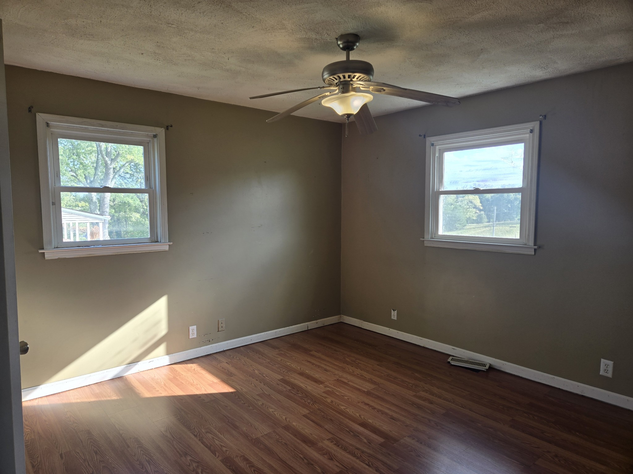 4671 Talley Road Springfield, TN 37172 - Photo 10 of 19 a view of an empty room with wooden floor and a window