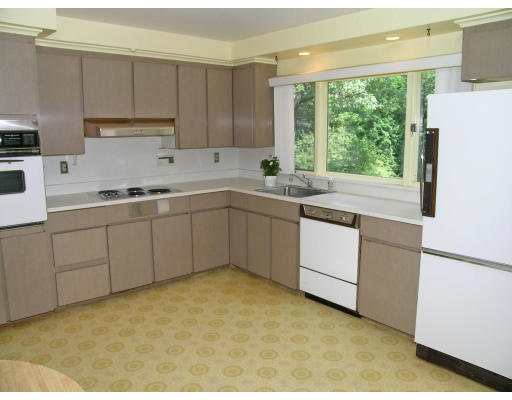 41 Woodfall Road Belmont, MA 02478 - Photo 7 of 8 a kitchen with a sink stove and cabinets