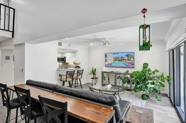 a view of a dining room with furniture and wooden floor