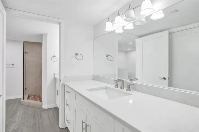 a bathroom with a sink a vanity and a mirror
