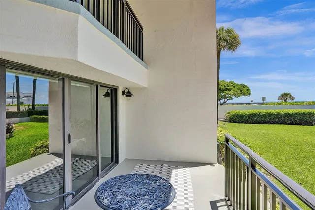 a balcony with view of outdoor space