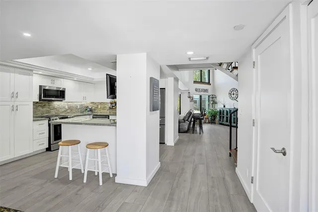 a view of a kitchen and dining room