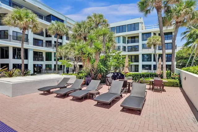 a view of a building with sitting area