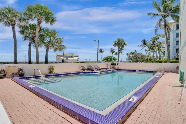 a view of a swimming pool with a patio