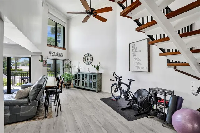 a view of a livingroom with furniture and gym equipment