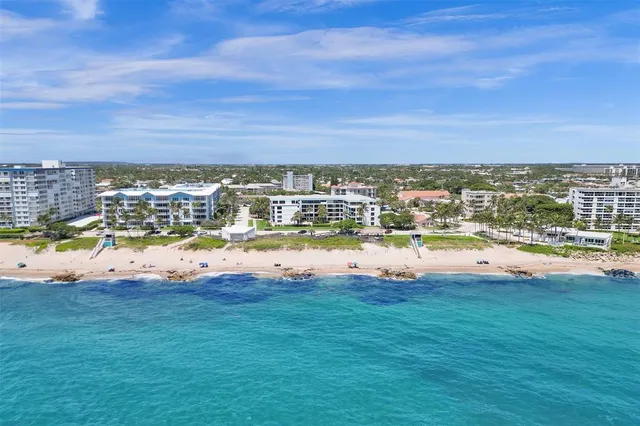 a view of houses with swimming pool